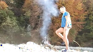 smoking hot nudist at campfire